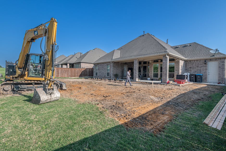 Adelaide backyard mid-renovation with paving, retaining wall and pergola in progress