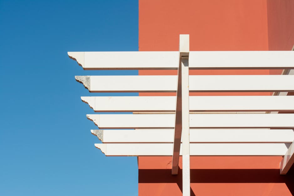 Adelaide builder reviewing pergola development application paperwork on site
