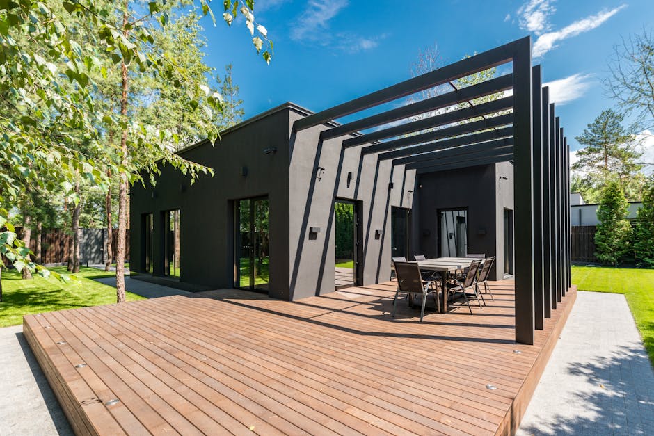 Adelaide louvred pergola with rotating slats partially open over outdoor dining area