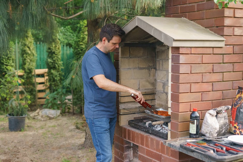 Adelaide outdoor kitchen with built-in BBQ, stone benchtop and pendant lighting